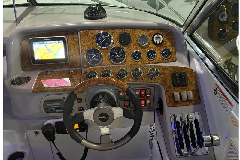  Yacht Photos Pics 2008 Formula 330 Sun Sport boat dashboard with steering wheel and navigation controls.