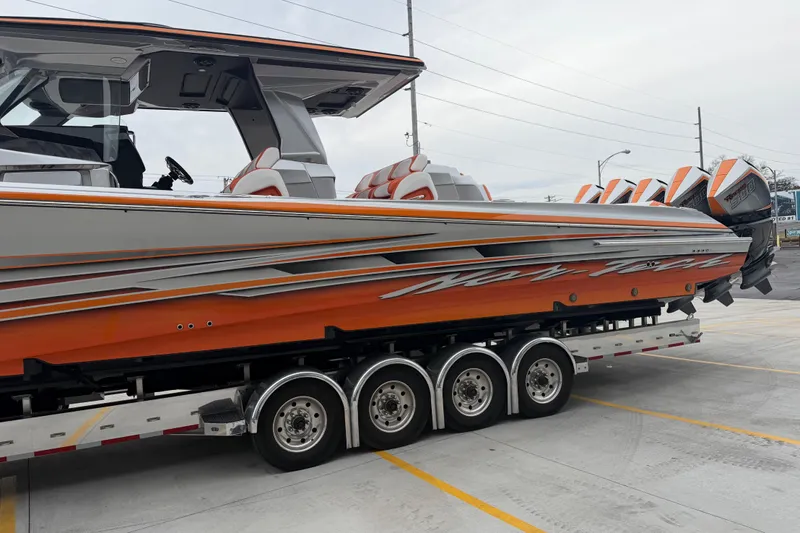  Yacht Photos Pics 2024 Nor-Tech 500 Sport Center Console boat on trailer, featuring vibrant orange and gray design.