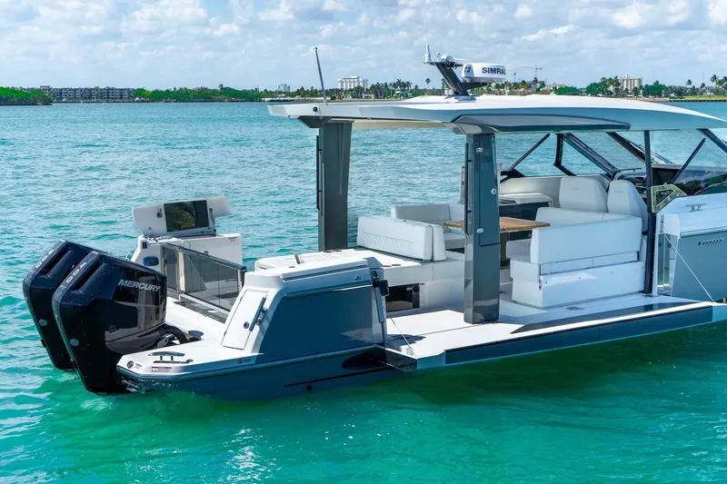  Yacht Photos Pics 2025 Saxdor 400 GTO luxury boat on turquoise water, featuring sleek design and powerful engines.