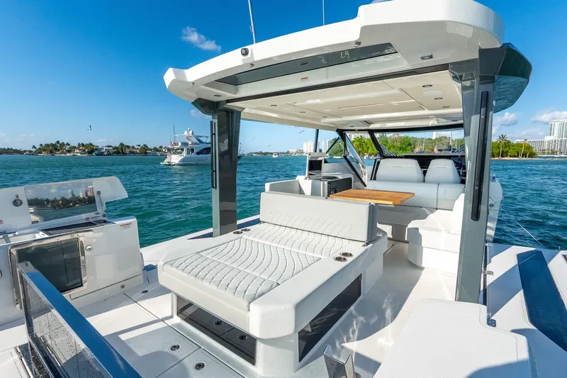  Yacht Photos Pics 2025 Saxdor 400 GTO luxury yacht interior with seating and table on open water.