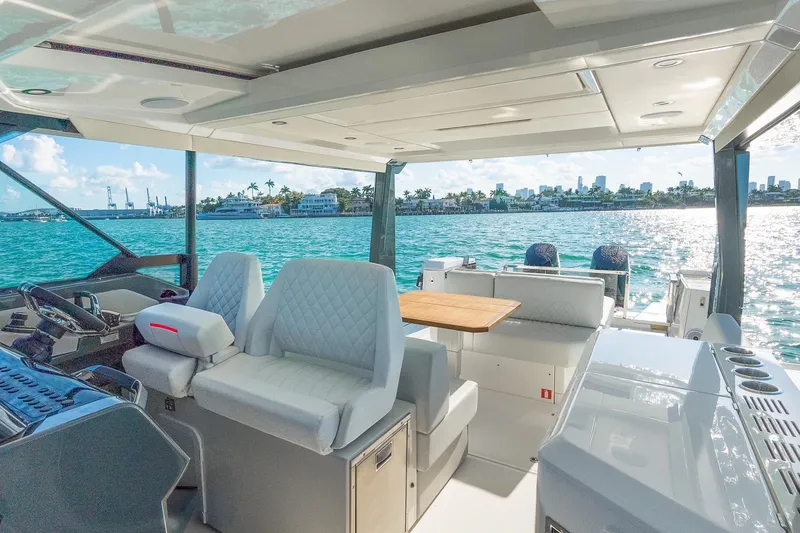 Yacht Photos Pics Luxurious 2025 Saxdor 400 GTO yacht interior with ocean view and modern seating.