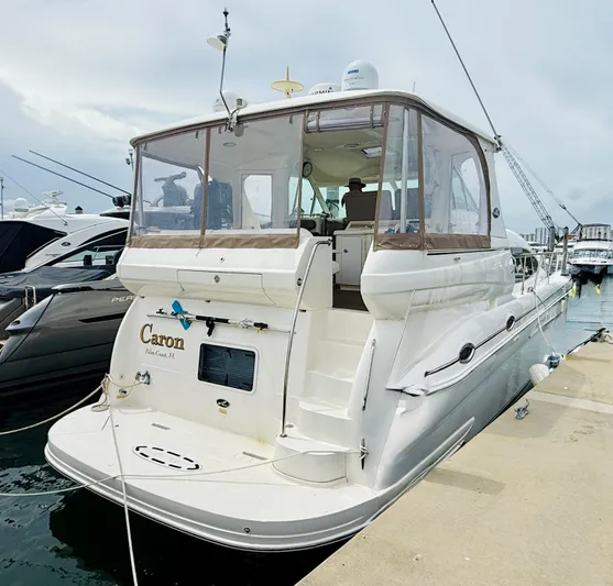  Yacht Photos Pics 2003 Sea Ray 480 Motor Yacht docked at marina, rear view.