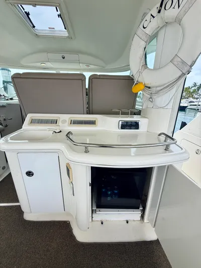  Yacht Photos Pics 2003 Sea Ray 480 Motor Yacht interior with kitchenette and life preserver.