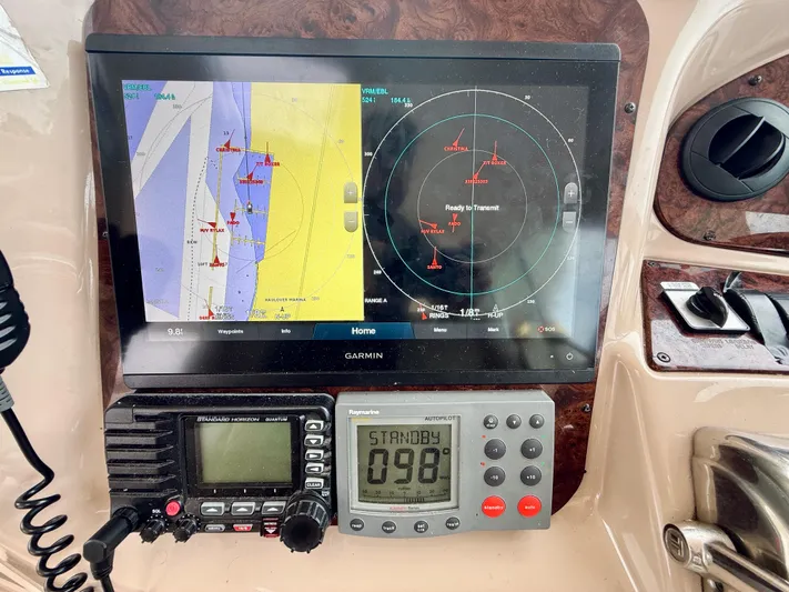  Yacht Photos Pics Garmin navigation system on 2003 Sea Ray 480 Motor Yacht dashboard with radar and communication devices.