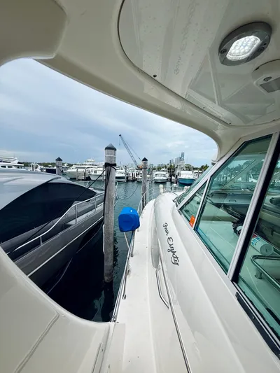  Yacht Photos Pics 2003 Sea Ray 480 Motor Yacht docked at marina, overcast sky, luxury boating scene.