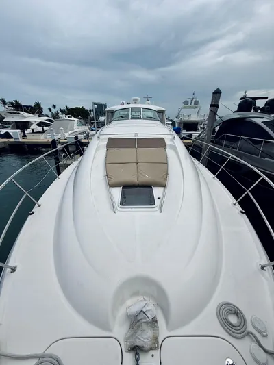  Yacht Photos Pics 2003 Sea Ray 480 Motor Yacht docked at marina under cloudy sky.