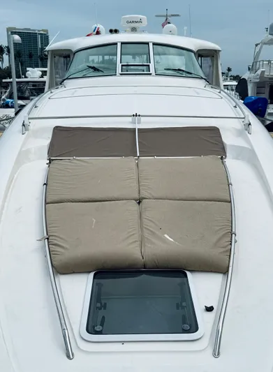  Yacht Photos Pics 2003 Sea Ray 480 Motor Yacht with cushioned sun deck and hatch, docked at marina.