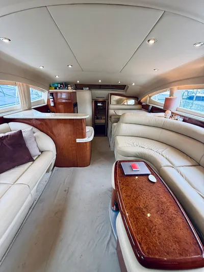 Yacht Photos Pics Luxurious interior of a 2003 Sea Ray 480 Motor Yacht with elegant seating and wood finishes.