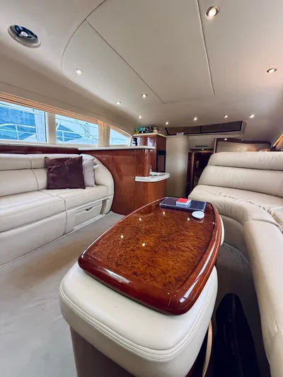  Yacht Photos Pics Luxurious interior of 2003 Sea Ray 480 Motor Yacht with plush seating and elegant wood finishes.