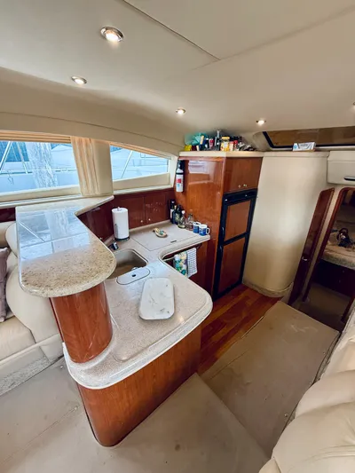  Yacht Photos Pics Luxurious 2003 Sea Ray 480 Motor Yacht interior with modern kitchen and elegant wood finishes.