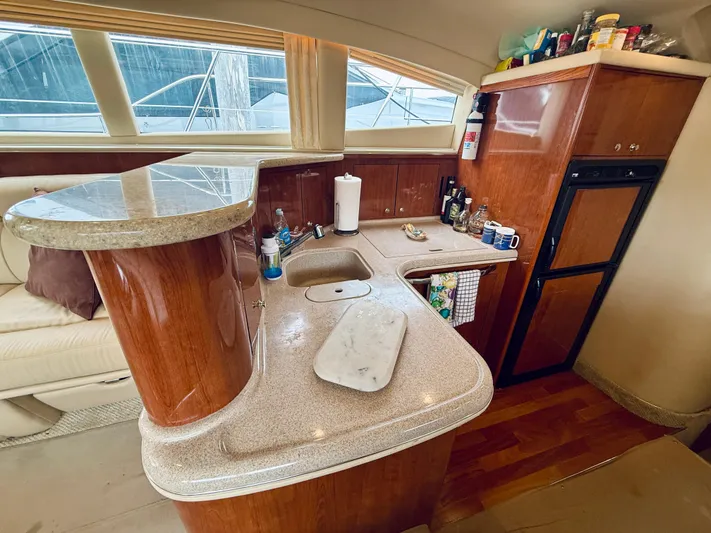  Yacht Photos Pics Interior of 2003 Sea Ray 480 Motor Yacht kitchen with countertop and appliances.