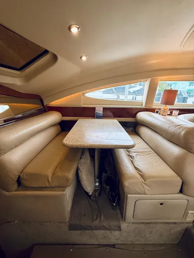  Yacht Photos Pics Luxurious interior of 2003 Sea Ray 480 Motor Yacht with plush seating and elegant table.