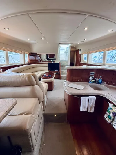  Yacht Photos Pics Luxurious interior of 2003 Sea Ray 480 Motor Yacht with plush seating and modern amenities.