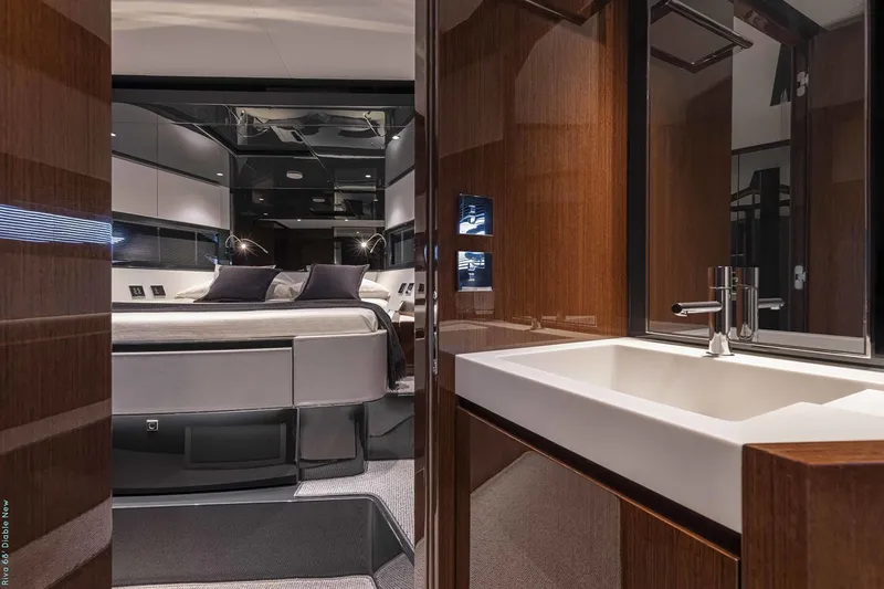  Yacht Photos Pics Manufacturer Provided Image: Luxurious interior of 2026 Riva 68' Diable yacht, featuring modern bedroom and sleek bathroom.