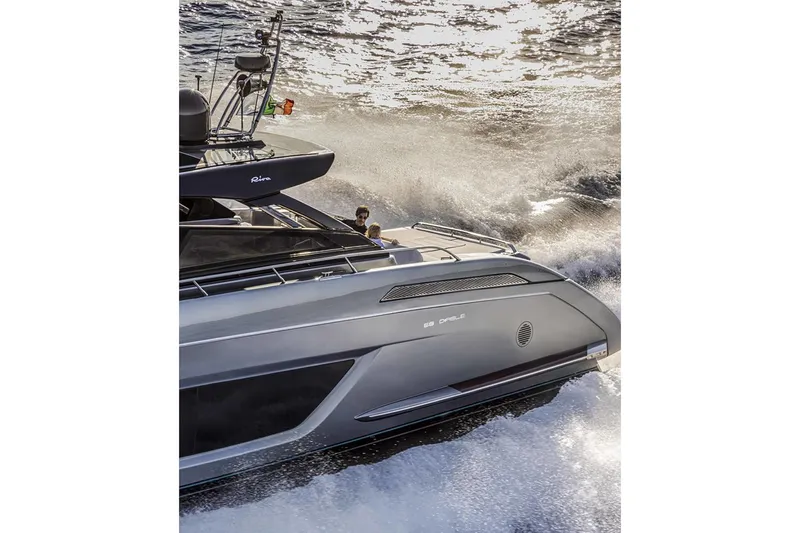  Yacht Photos Pics Manufacturer Provided Image: 2026 Riva 68' Diable yacht cruising through waves, showcasing sleek design and luxury.