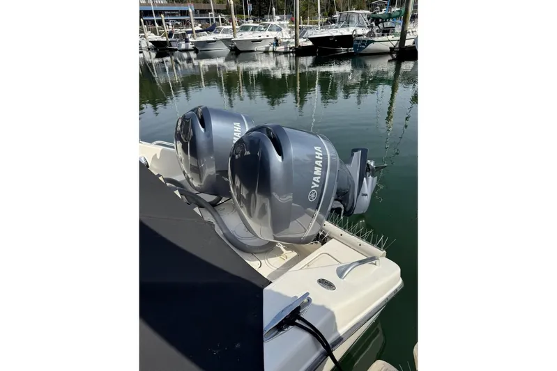 Good Fun Yacht Photos Pics 2006 Pursuit 3370 Offshore boat with twin Yamaha outboard engines at marina.