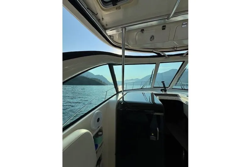 Good Fun Yacht Photos Pics Interior view of 2006 Pursuit 3370 Offshore boat with scenic ocean backdrop.