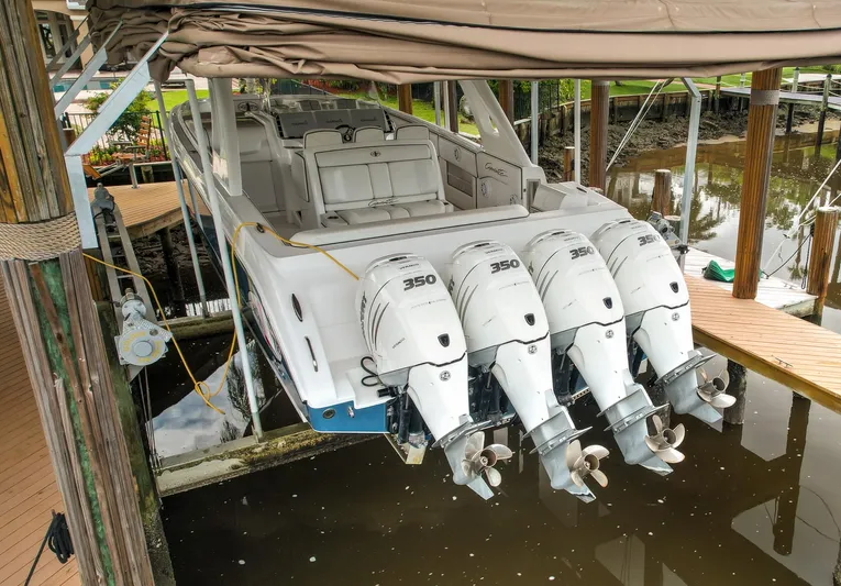  Yacht Photos Pics 2015 Cigarette 42 Huntress boat with four powerful outboard engines docked in a marina.