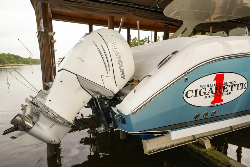  Yacht Photos Pics 2015 Cigarette 42 Huntress boat with Mercury outboard engine in dock.