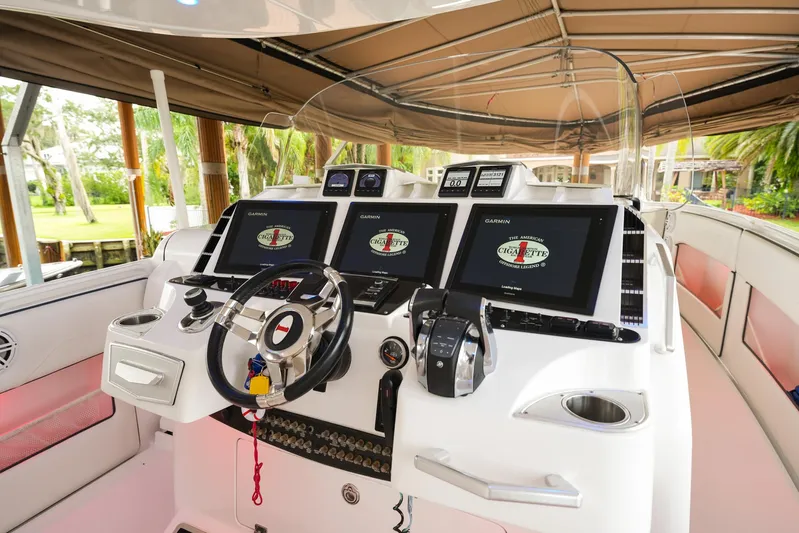  Yacht Photos Pics 2015 Cigarette 42 Huntress boat cockpit with advanced navigation systems and sleek design.