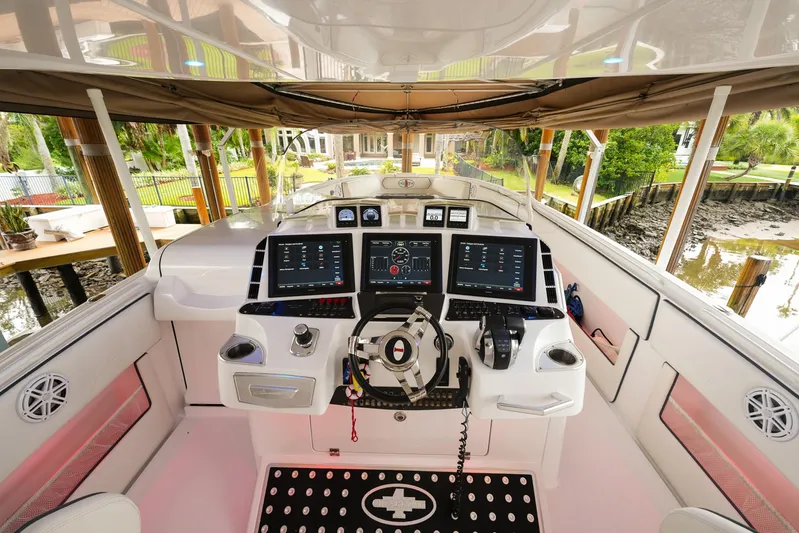  Yacht Photos Pics 2015 Cigarette 42 Huntress boat cockpit with advanced navigation systems and controls.