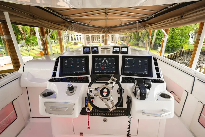  Yacht Photos Pics 2015 Cigarette 42 Huntress helm with advanced navigation displays and controls.