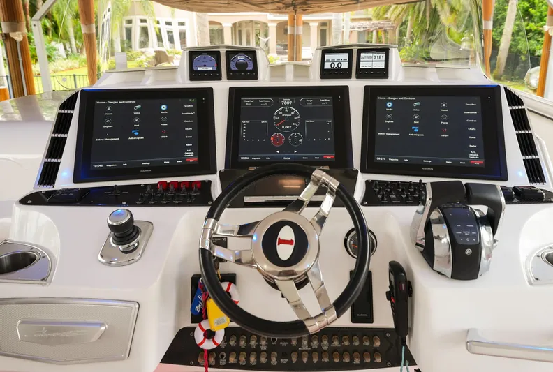  Yacht Photos Pics Helm of 2015 Cigarette 42 Huntress with advanced navigation displays and controls.