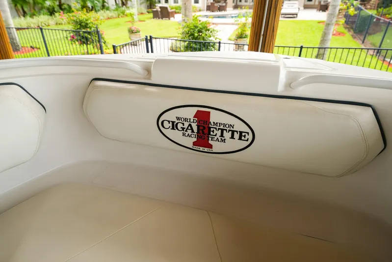  Yacht Photos Pics 2015 Cigarette 42 Huntress boat interior with branded seat cushion, showcasing luxury design.