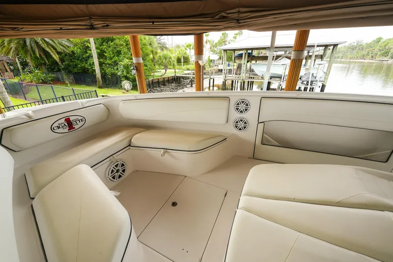  Yacht Photos Pics 2015 Cigarette 42 Huntress boat interior with beige seating and waterfront view.