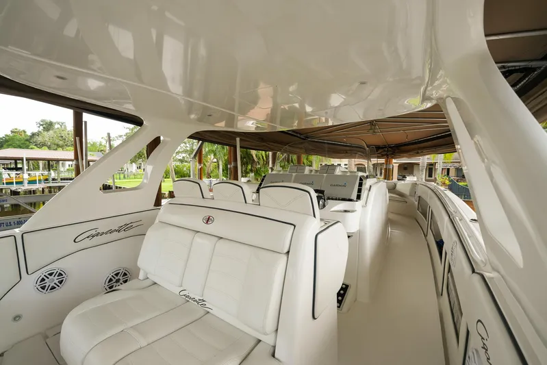  Yacht Photos Pics 2015 Cigarette 42 Huntress boat interior with white seating and sleek design.
