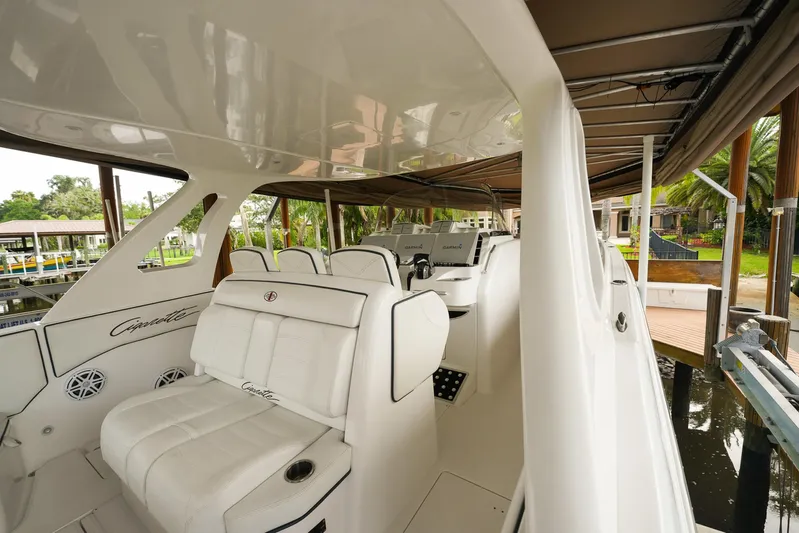  Yacht Photos Pics 2015 Cigarette 42 Huntress boat interior with white seating and sleek design.