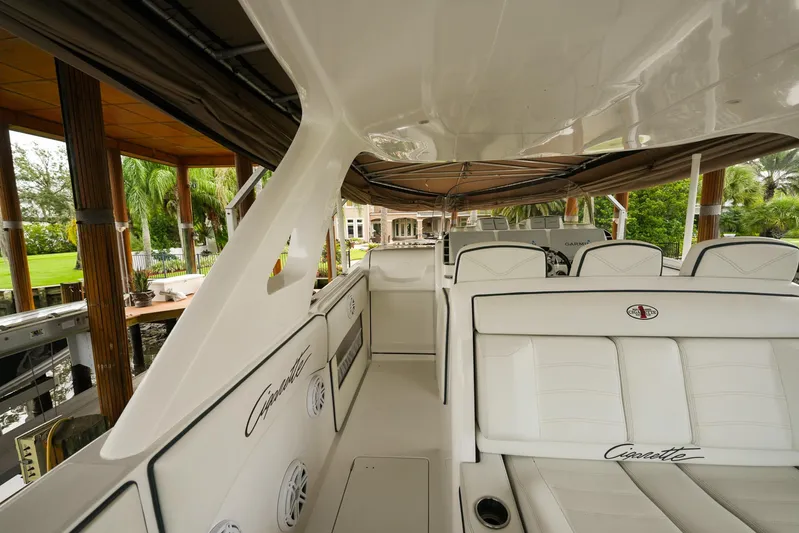  Yacht Photos Pics 2015 Cigarette 42 Huntress boat interior with white seating and sleek design.