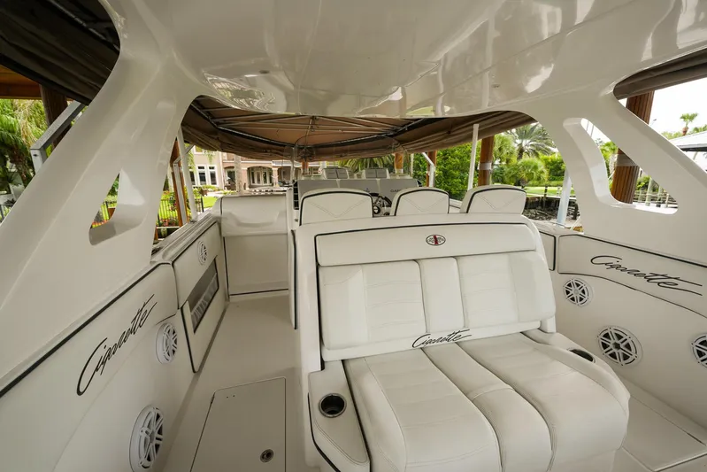  Yacht Photos Pics 2015 Cigarette 42 Huntress boat interior with white seating and sleek design.