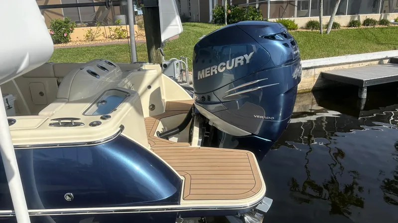  Yacht Photos Pics 2023 Chris-Craft Catalina 24 with Mercury outboard engine, docked by the water.