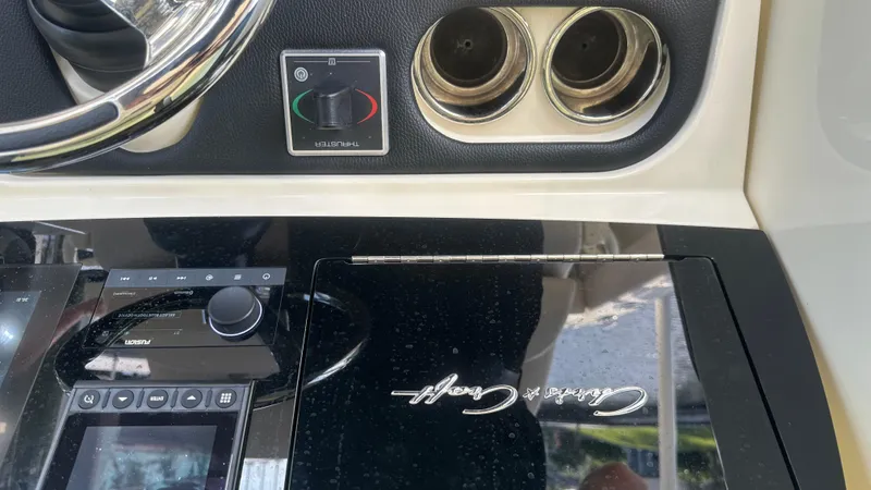  Yacht Photos Pics 2023 Chris-Craft Catalina 24 dashboard with controls and logo.