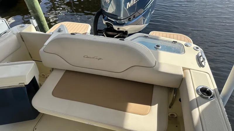  Yacht Photos Pics 2023 Chris-Craft Catalina 24 boat interior with seating and motor view.
