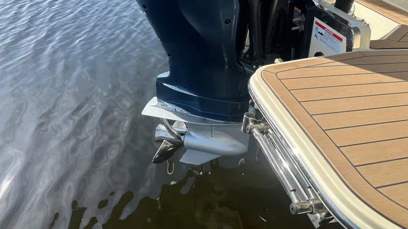  Yacht Photos Pics 2023 Chris-Craft Catalina 24 boat engine and swim platform on water.