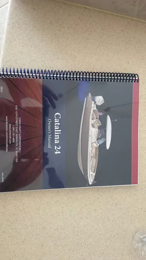  Yacht Photos Pics 2023 Chris-Craft Catalina 24 owner's manual on a beige surface.