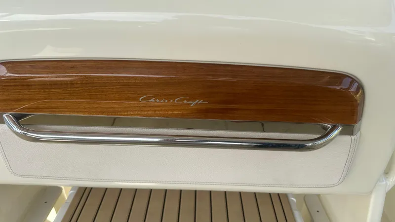  Yacht Photos Pics 2023 Chris-Craft Catalina 24 interior detail with wood and chrome accents.