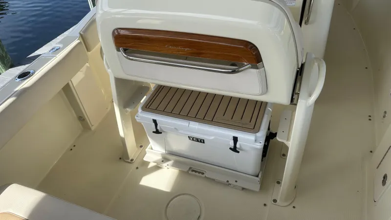  Yacht Photos Pics 2023 Chris-Craft Catalina 24 boat interior with cooler storage under seat.