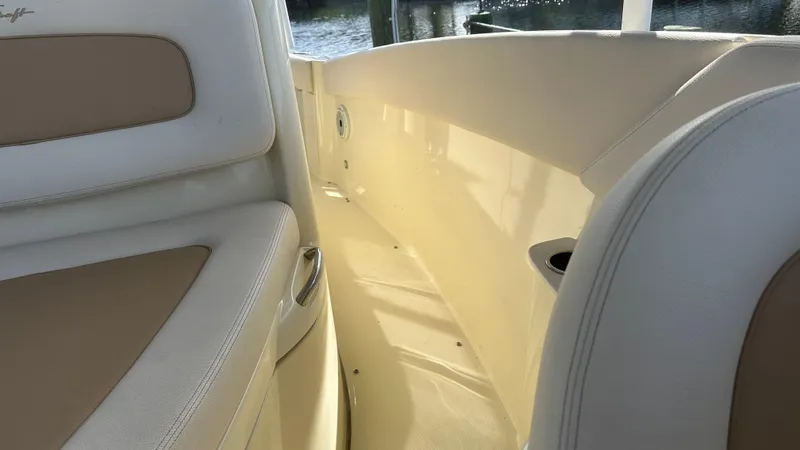  Yacht Photos Pics 2023 Chris-Craft Catalina 24 interior with beige and white seating, showcasing luxury design.