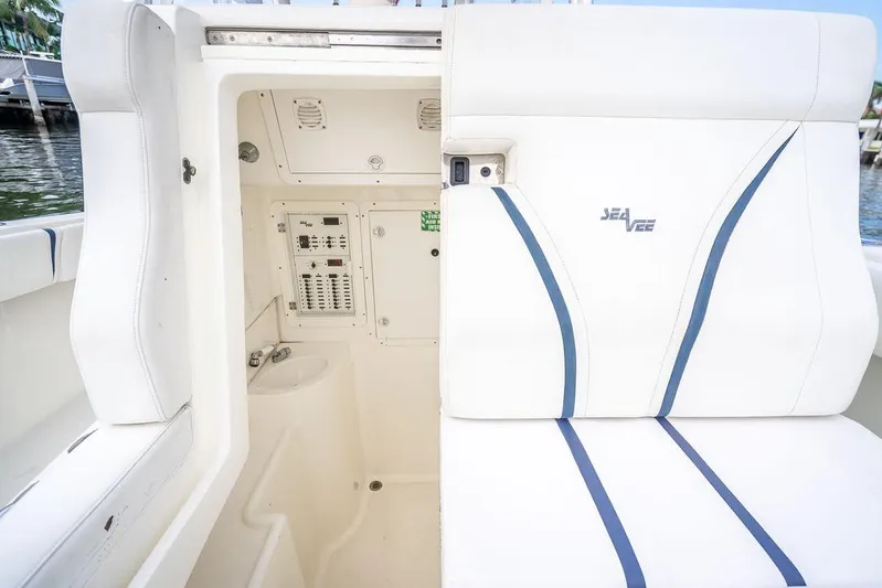 Nauti Gator Yacht Photos Pics 2014 SeaVee 34 boat interior with white seating and control panel.