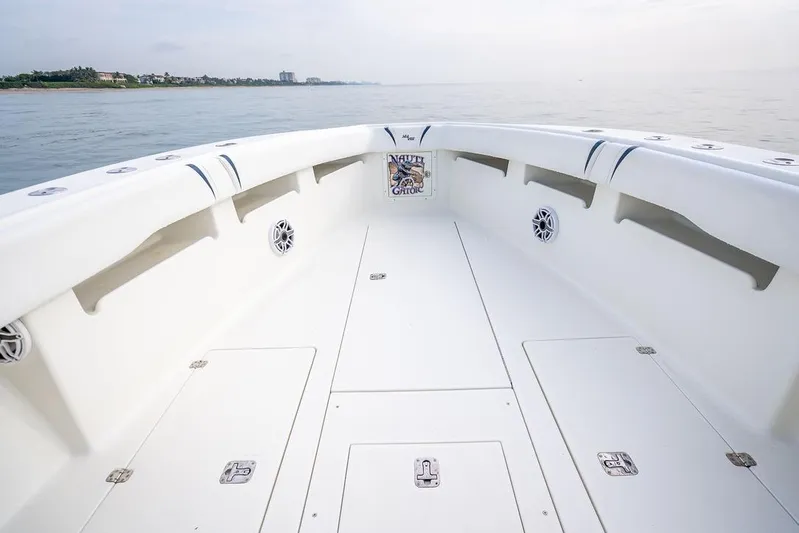 Nauti Gator Yacht Photos Pics 2014 SeaVee 34 boat deck with spacious seating and ocean view.