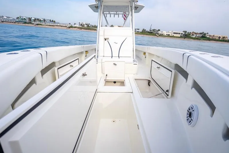 Nauti Gator Yacht Photos Pics 2014 SeaVee 34 boat interior with open storage compartments, cruising on calm waters.