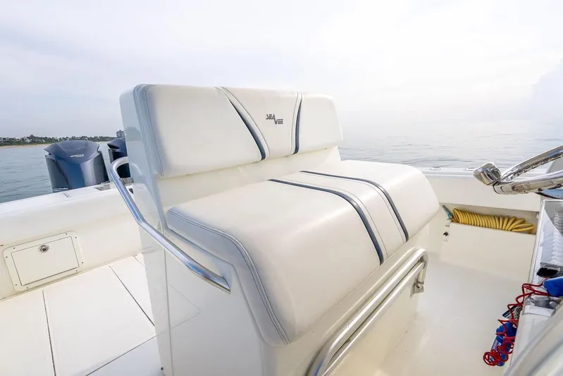 Nauti Gator Yacht Photos Pics 2014 SeaVee 34 boat interior with white seating and ocean view.