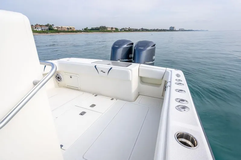 Nauti Gator Yacht Photos Pics 2014 SeaVee 34 boat with dual engines on calm water.