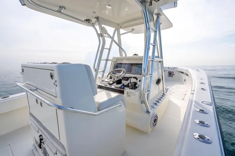 Nauti Gator Yacht Photos Pics 2014 SeaVee 34 boat interior with helm, ocean view, and modern design.