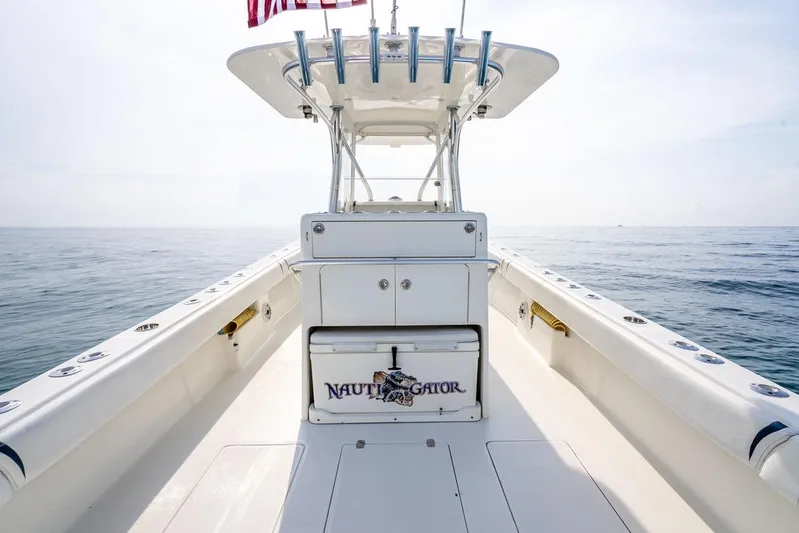 Nauti Gator Yacht Photos Pics 2014 SeaVee 34 boat deck with open ocean view and American flag.
