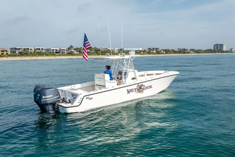 Nauti Gator Yacht Photos Pics 2014 SeaVee 34 boat with Yamaha engines cruising near the coast.