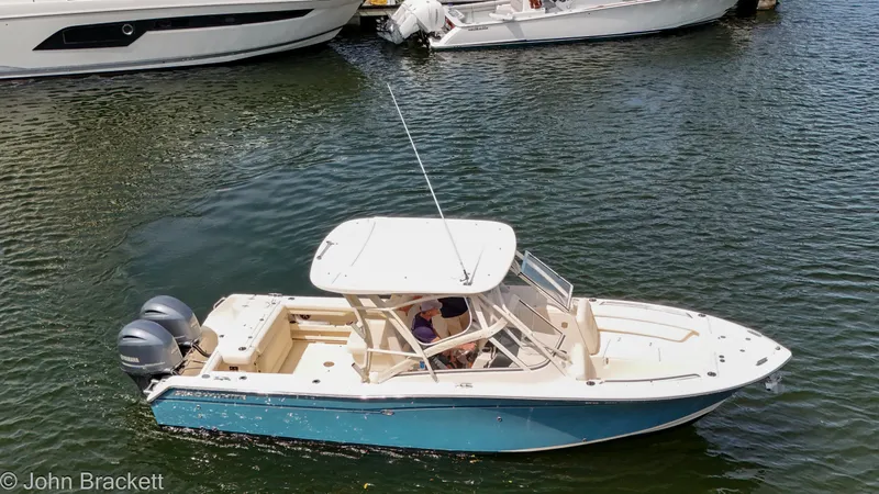 Yacht Photos Pics 2019 Grady-White Freedom 275 boat on water, featuring dual engines and sleek design.